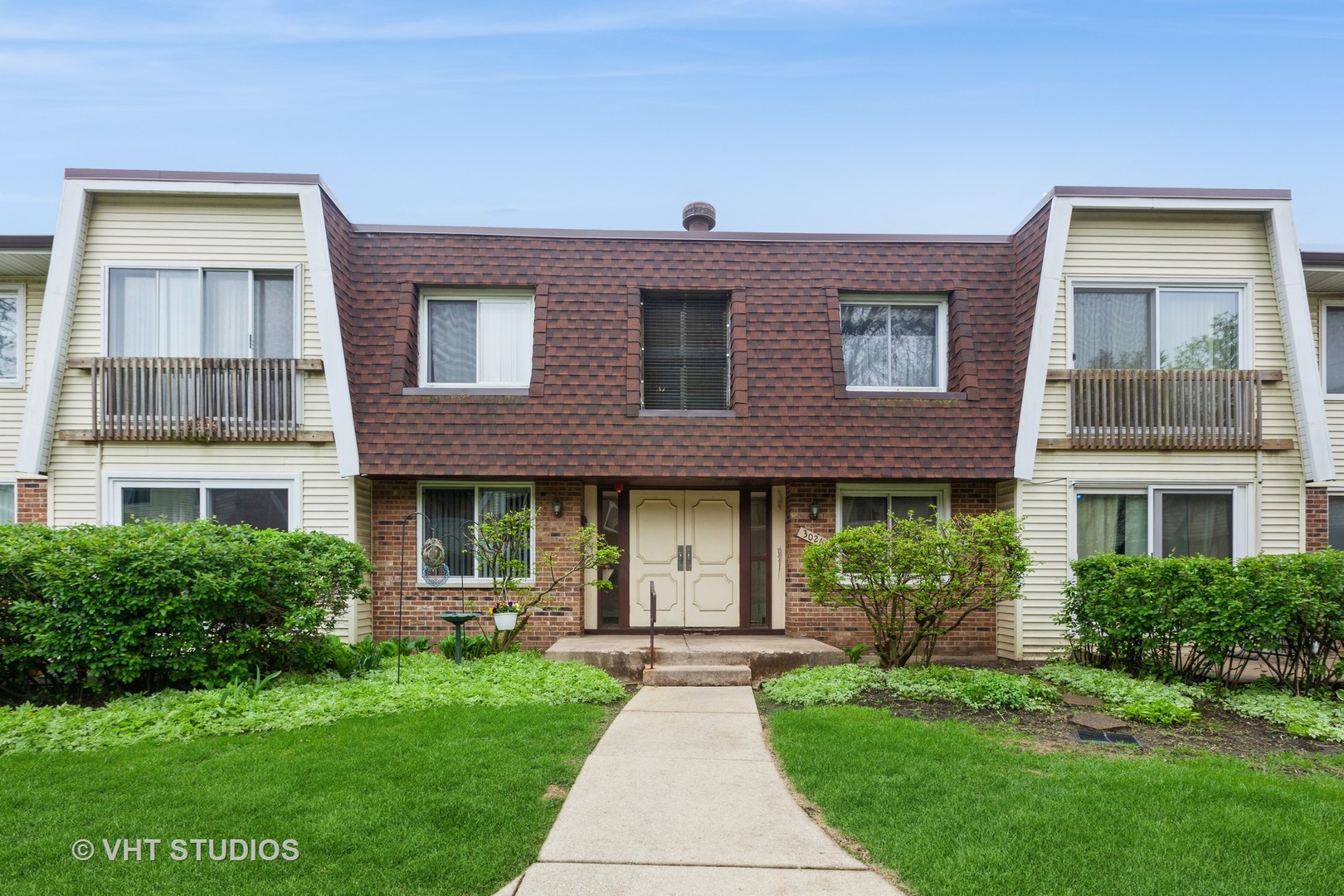 3026 Roberts Drive, Unit 4 Woodridge, IL 60517 - Photo 1 of 19 a front view of a house with a yard