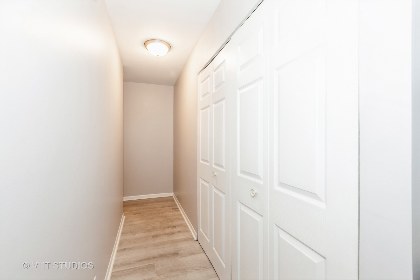 3026 Roberts Drive, Unit 4 Woodridge, IL 60517 - Photo 12 of 19 a view of a hallway with wooden floor and a bathroom
