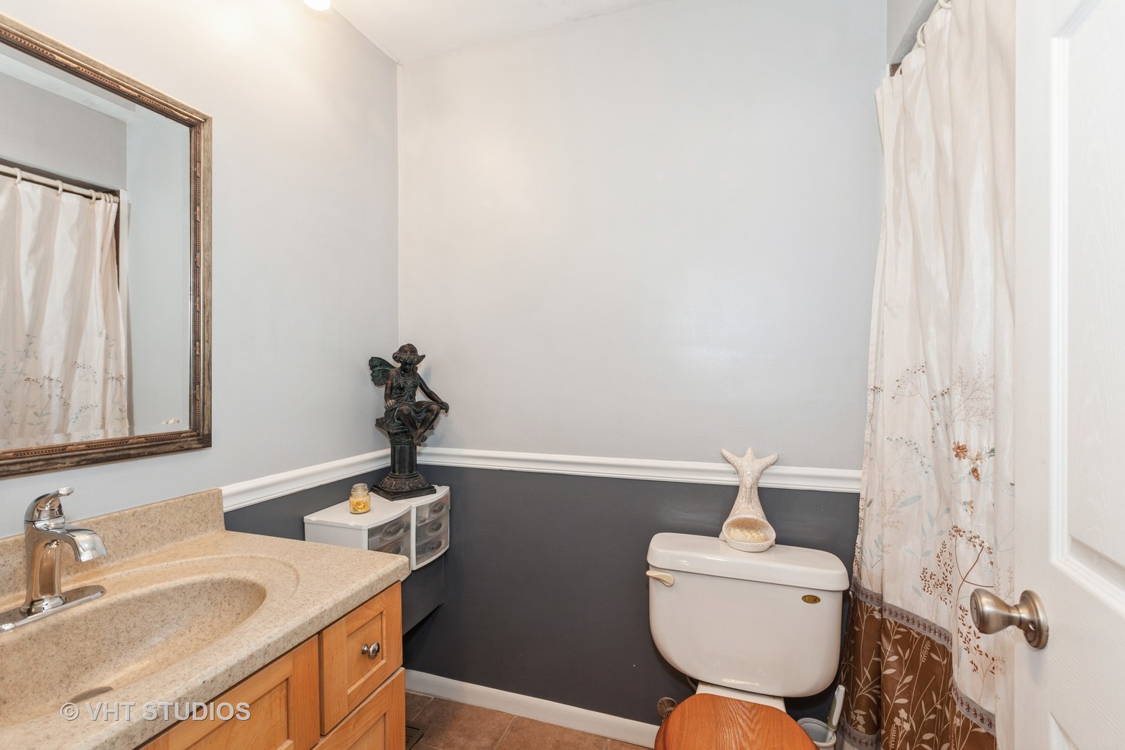 3026 Roberts Drive, Unit 4 Woodridge, IL 60517 - Photo 10 of 19 a bathroom with a sink a toilet and a mirror