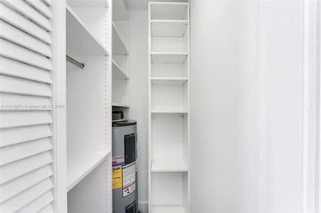 a kitchen with a refrigerator and cabinets