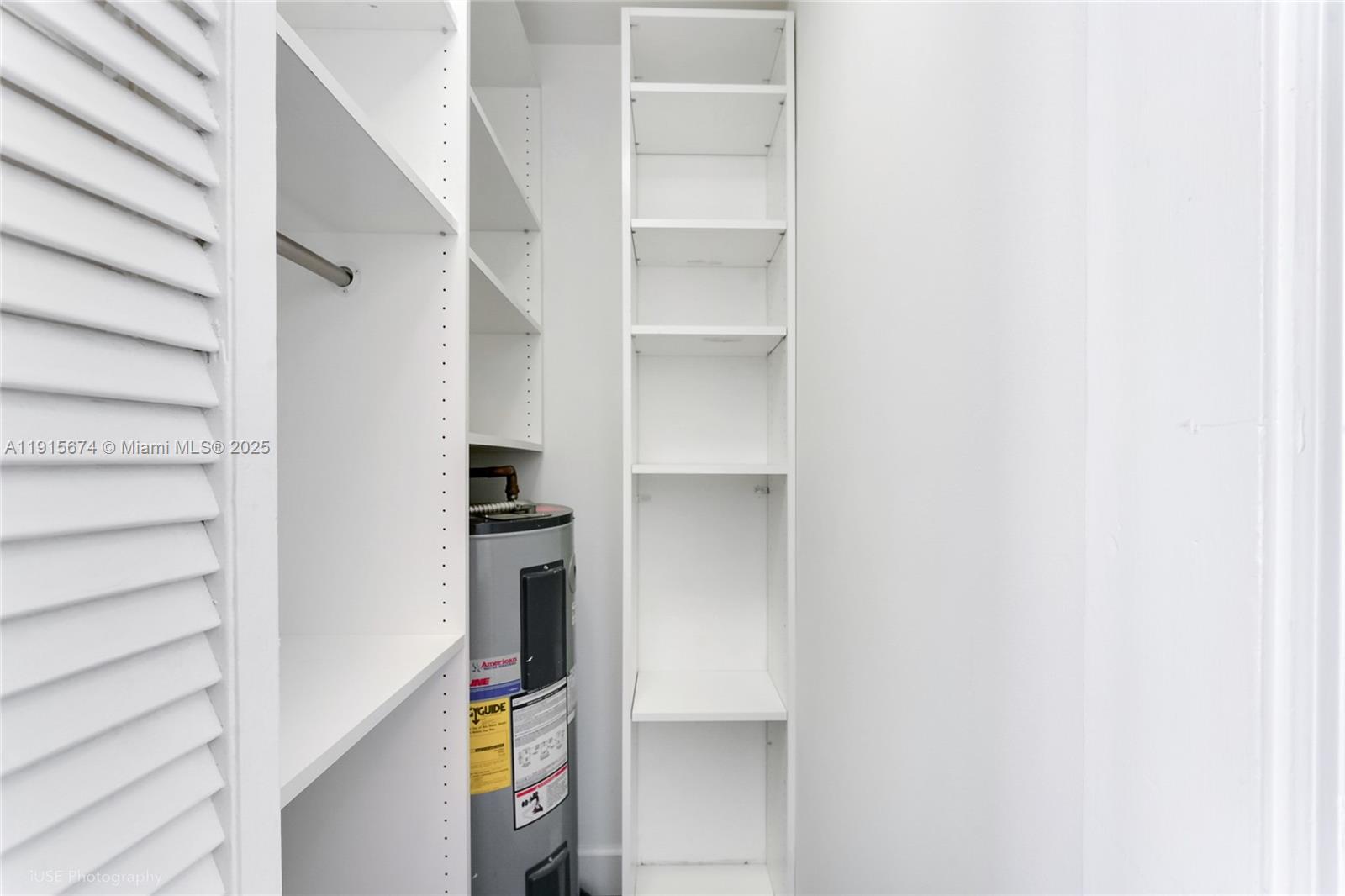 2970 Bird Avenue, Unit 15 Miami, FL 33133 - Photo 15 of 18 a kitchen with a refrigerator and cabinets