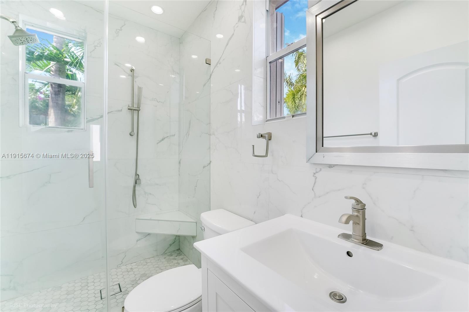 2970 Bird Avenue, Unit 15 Miami, FL 33133 - Photo 10 of 18 a bathroom with a sink a toilet and shower