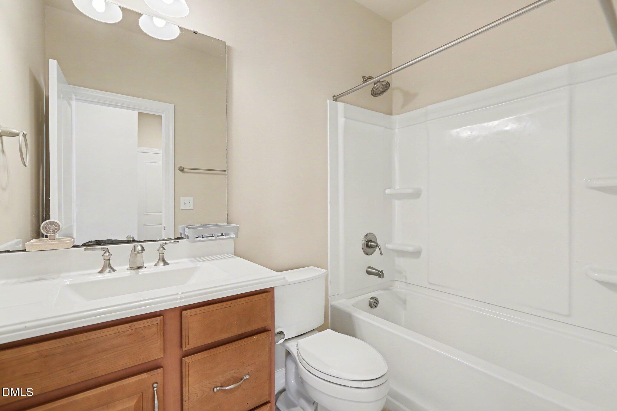 351 Gartrell Way Cary, NC 27519 - Photo 23 of 51 a bathroom with a sink a toilet and shower