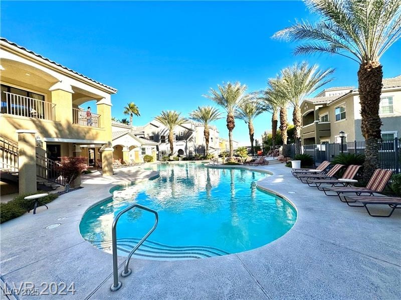8777 West Maule Avenue, Unit 2103 Las Vegas, NV 89148 - Photo 29 of 33 Community pool with a patio, a balcony, and a residential view