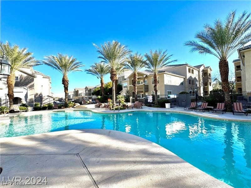 8777 West Maule Avenue, Unit 2103 Las Vegas, NV 89148 - Photo 30 of 33 Community pool with a patio area and a residential view