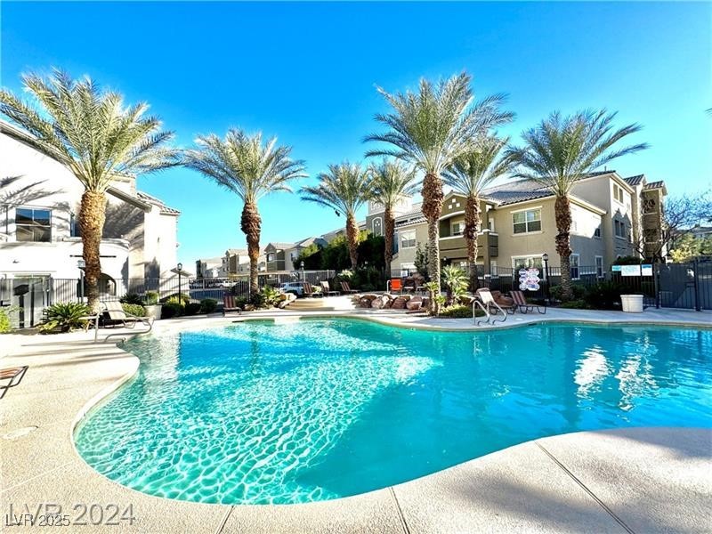 8777 West Maule Avenue, Unit 2103 Las Vegas, NV 89148 - Photo 31 of 33 Community pool with a patio