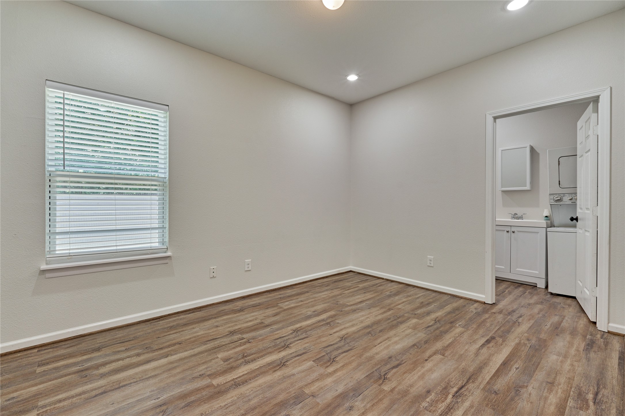 18147 Firepine Lane Montgomery, TX 77316 - Photo 16 of 25 wooden floor in an empty room with a window