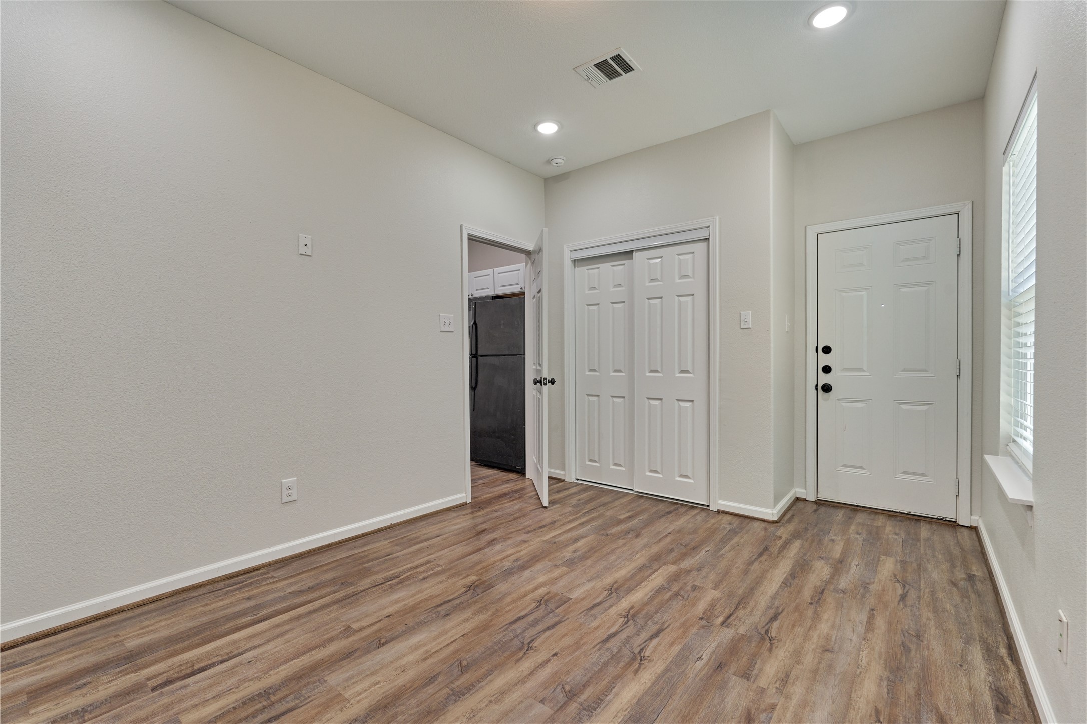 18147 Firepine Lane Montgomery, TX 77316 - Photo 17 of 25 wooden floor in an empty room with a window