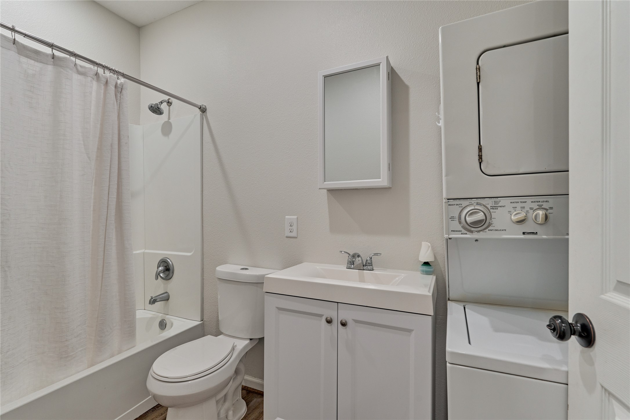 18147 Firepine Lane Montgomery, TX 77316 - Photo 18 of 25 a bathroom with a sink toilet and shower