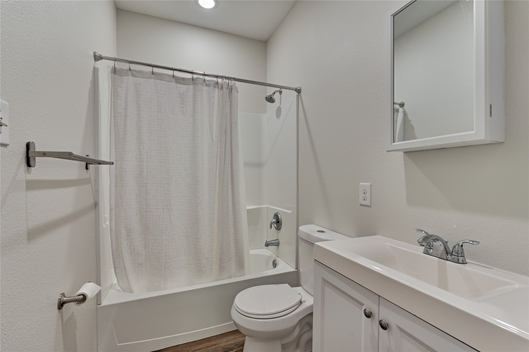 18147 Firepine Lane Montgomery, TX 77316 - Photo 19 of 25 a white toilet sitting next to a bathroom sink