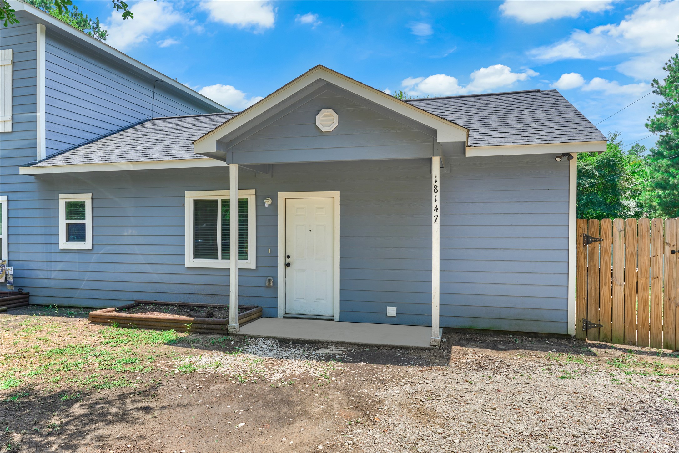 18147 Firepine Lane Montgomery, TX 77316 - Photo 4 of 25 a front view of a house with a yard