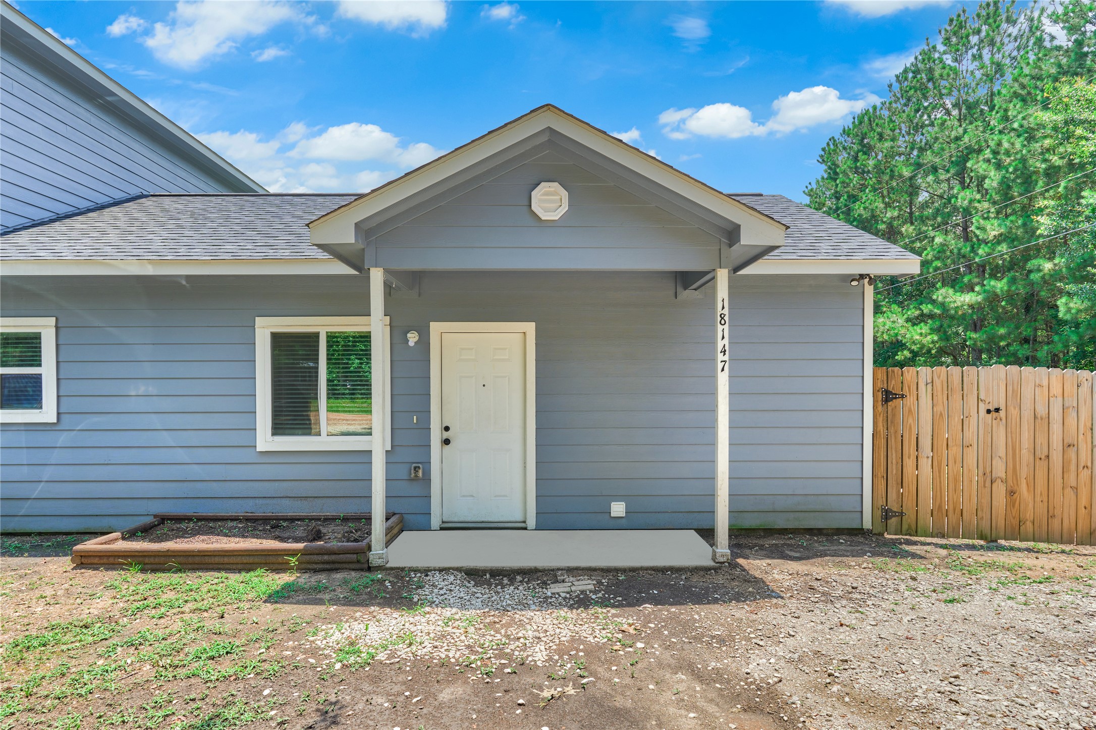 18147 Firepine Lane Montgomery, TX 77316 - Photo 5 of 25 a front view of a house with a yard