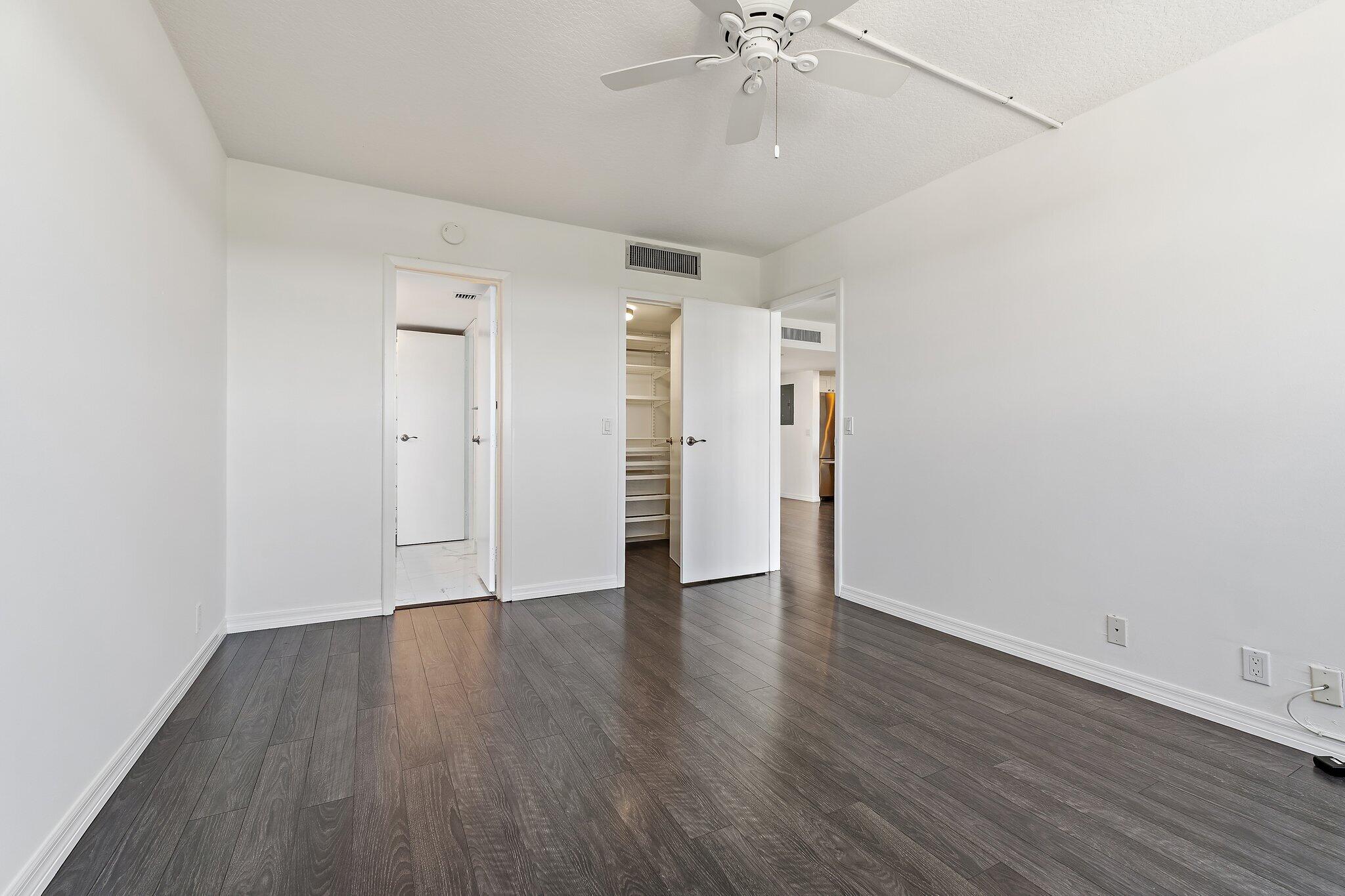 336 Golfview Road, Unit 719 North Palm Beach, FL 33408 - Photo 26 of 72 an empty room with wooden floor and ceiling fan