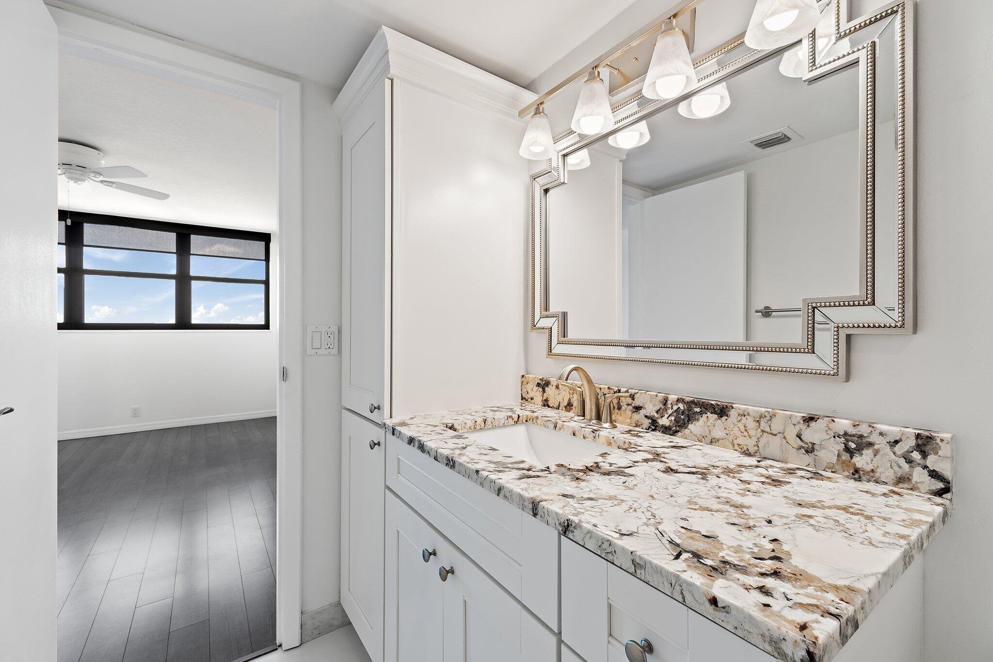 336 Golfview Road, Unit 719 North Palm Beach, FL 33408 - Photo 29 of 72 a bathroom with a sink and a mirror