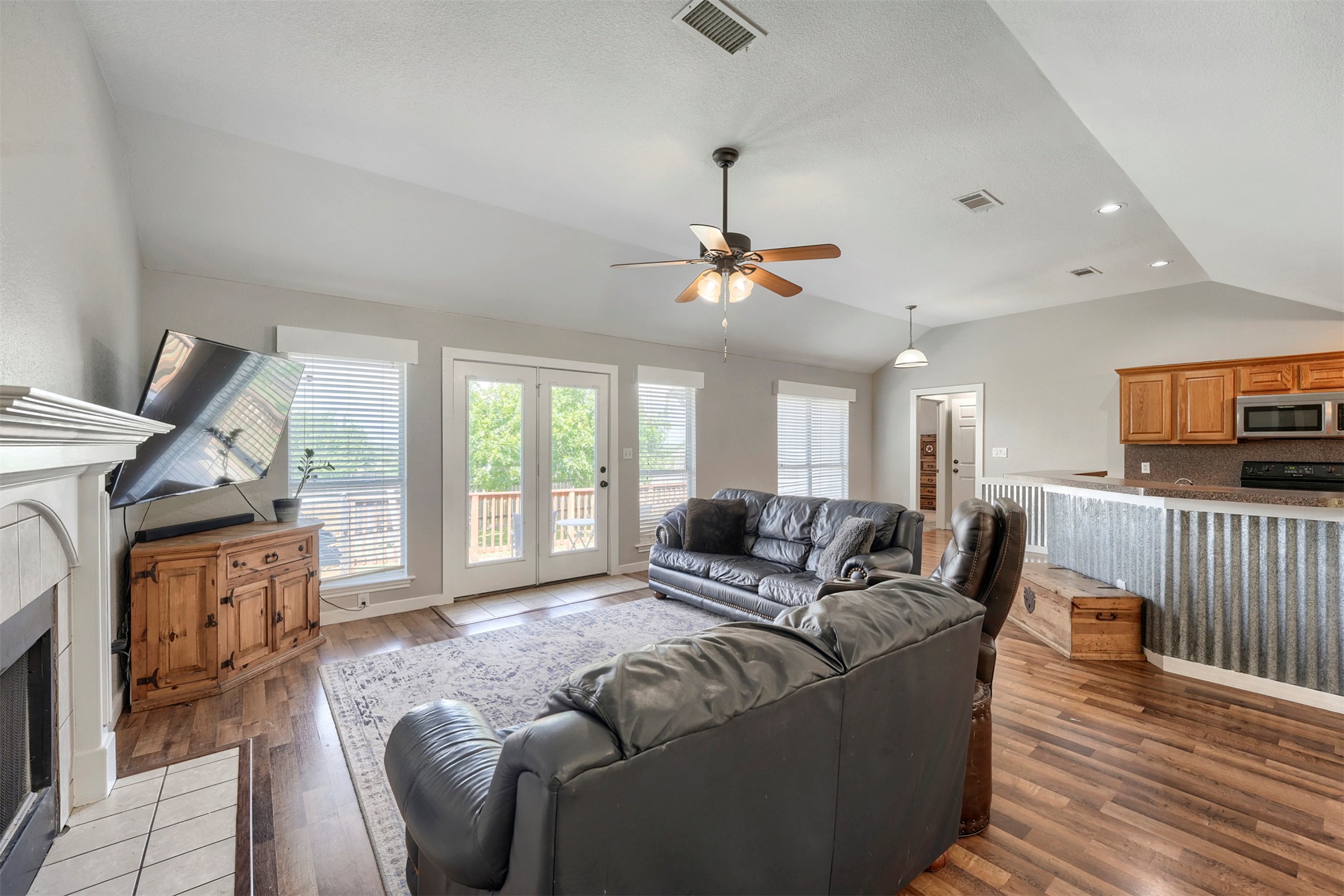 1105 2nd Street Jarrell, TX 76537 - Photo 3 of 27 Natural light floods this inviting living space featuring French doors that open to a scenic view.