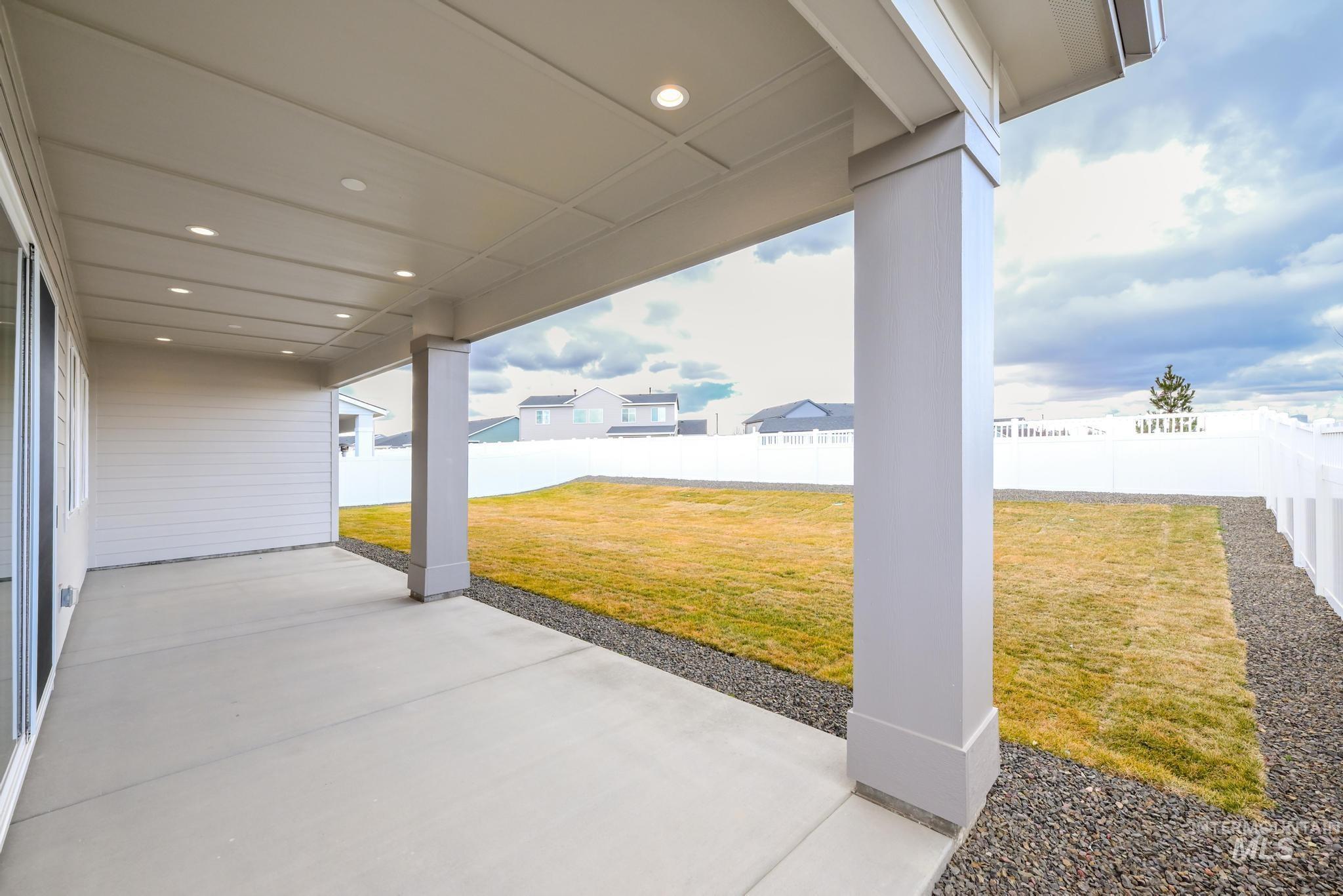 8501 South Country Wind Avenue Meridian, ID 83642 - Photo 27 of 39 Fenced backyard with a patio and a residential view