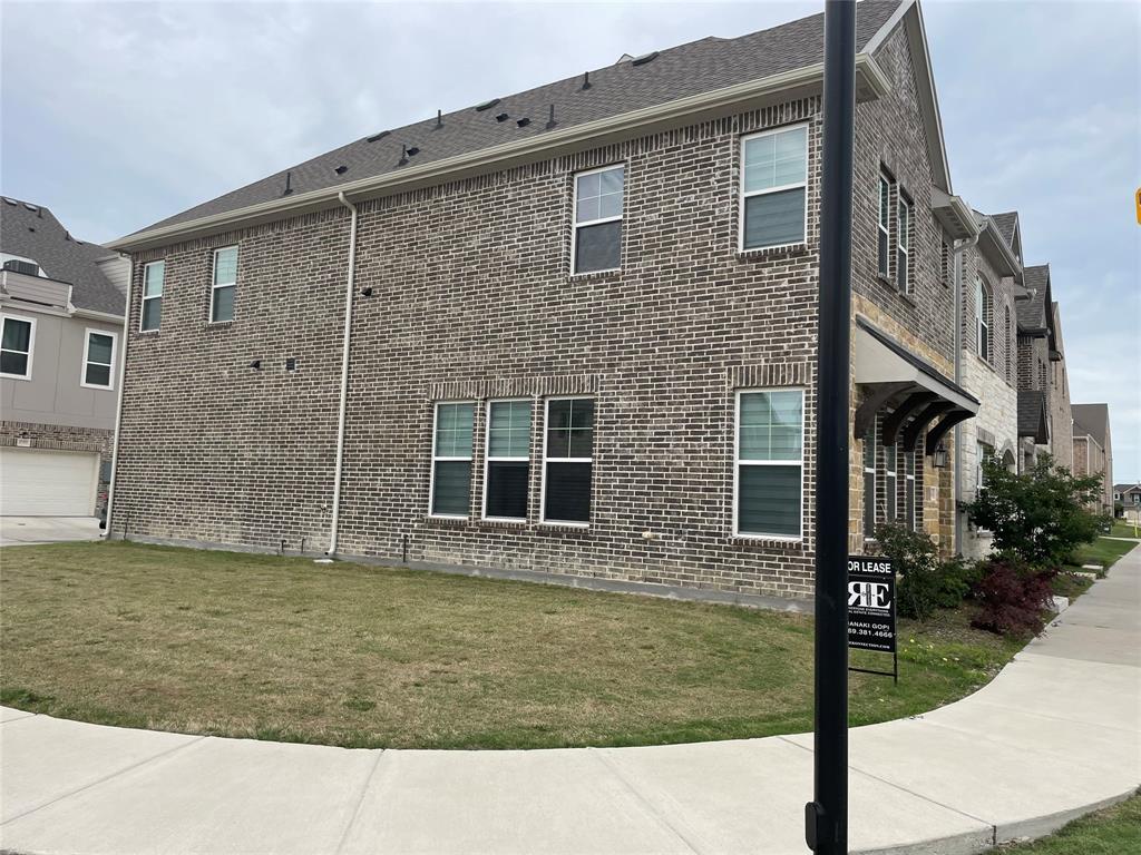 4704 Craymore Road Dallas, TX 75228 - Photo 12 of 14 a view of a brick house with many windows
