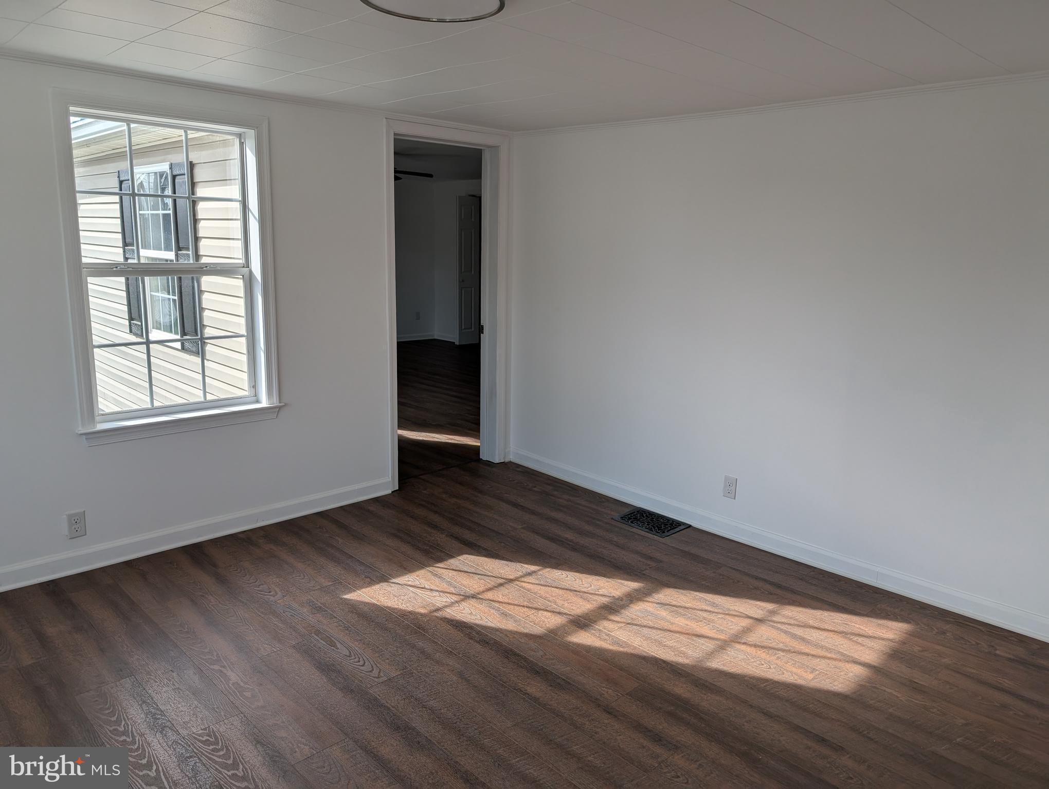 3296 Williamson Road Greencastle, PA 17225 - Photo 9 of 29 Living room view into Primary bedroom