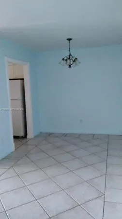 a view of empty room with closet