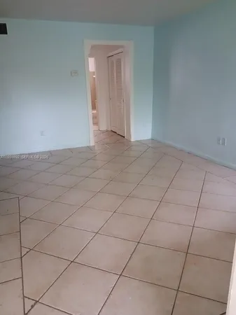 a view of a livingroom and entryway