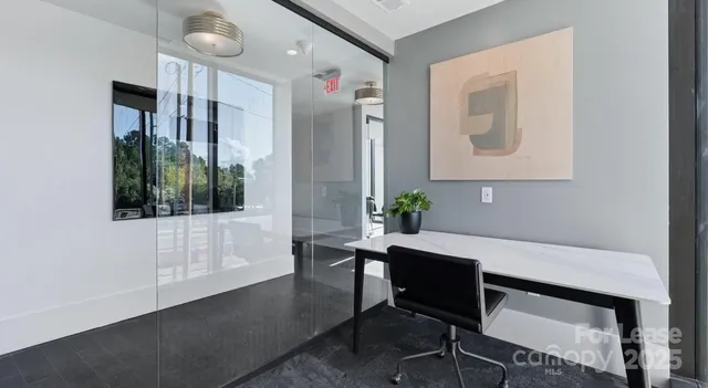 a view of a workspace with furniture