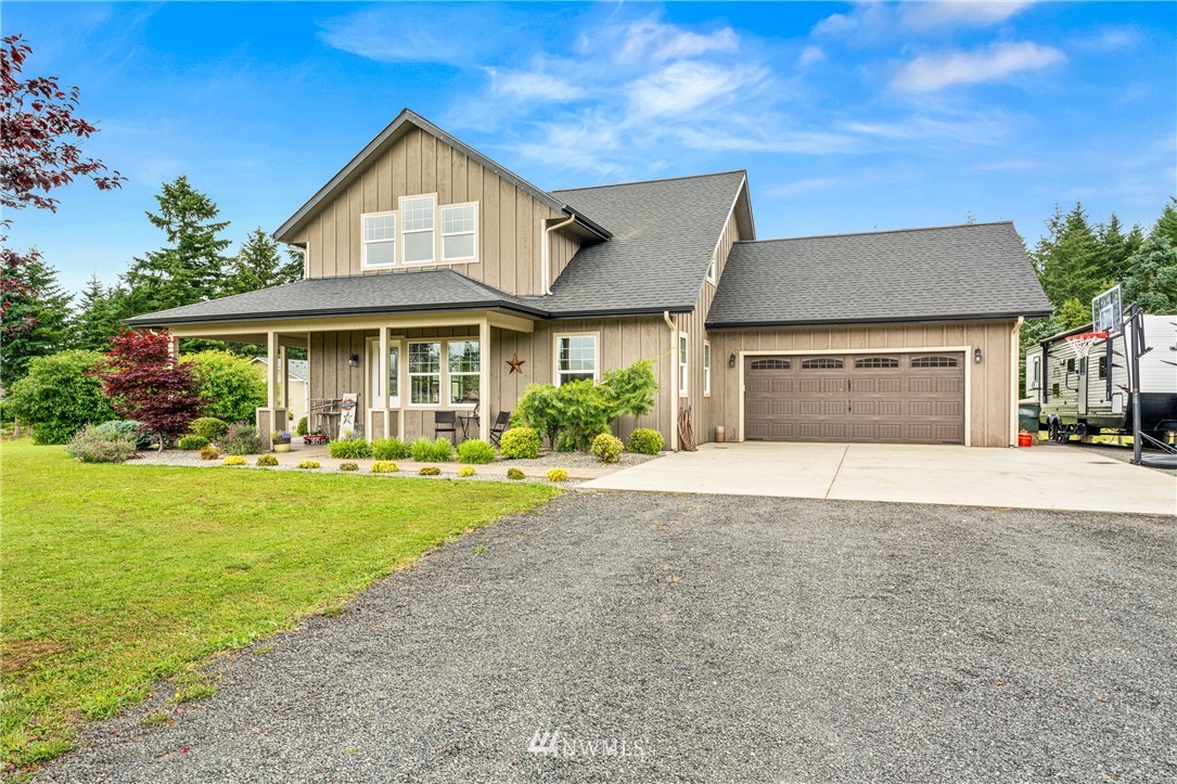 132-12 Pleasant Hill Road Chehalis, WA 98532 - Photo 1 of 25 a front view of a house with a yard and garage
