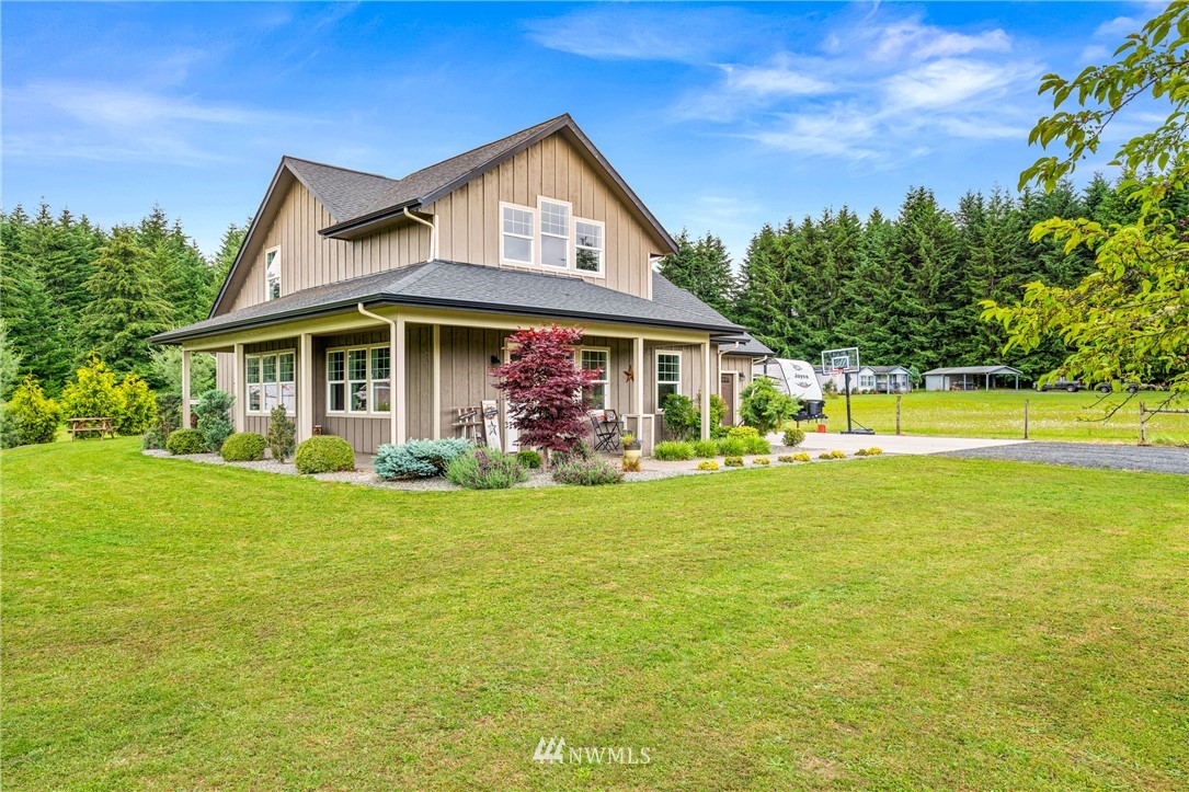 132-12 Pleasant Hill Road Chehalis, WA 98532 - Photo 2 of 25 a front view of a house with a garden