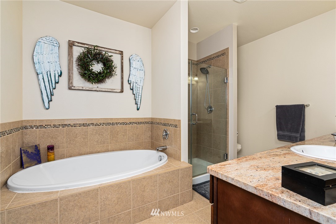132-12 Pleasant Hill Road Chehalis, WA 98532 - Photo 12 of 25 a bathroom with a granite countertop tub sink and mirror