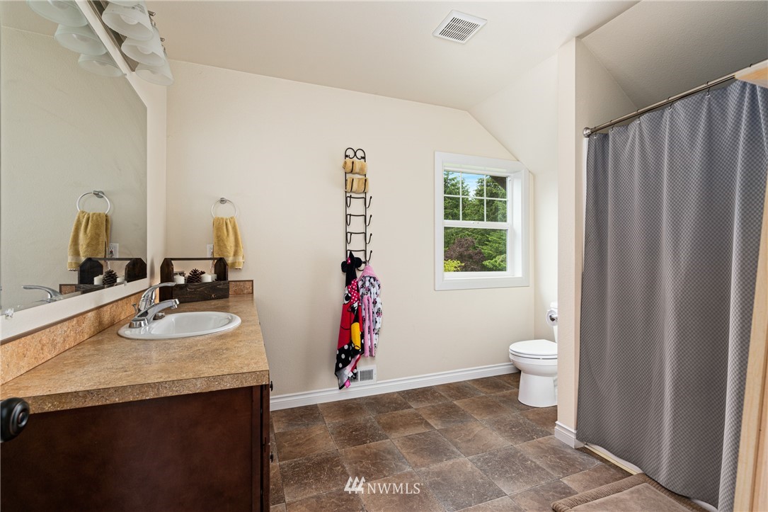 132-12 Pleasant Hill Road Chehalis, WA 98532 - Photo 20 of 25 a bathroom with a sink vanity mirror and toilet