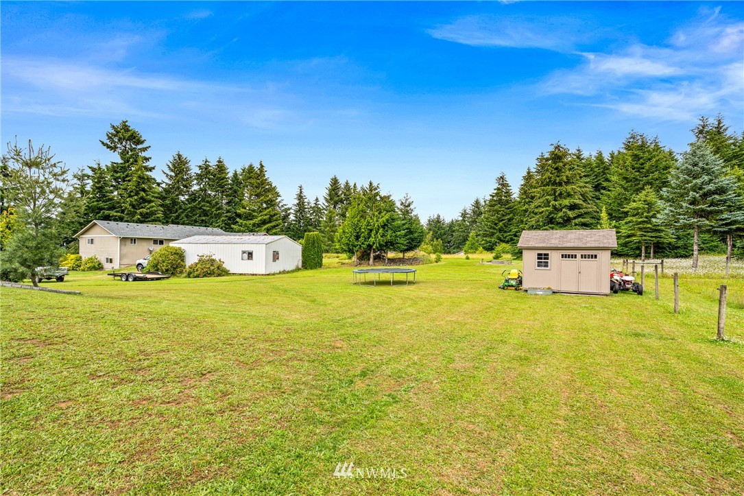 132-12 Pleasant Hill Road Chehalis, WA 98532 - Photo 24 of 25 a front view of a house with a yard and trees