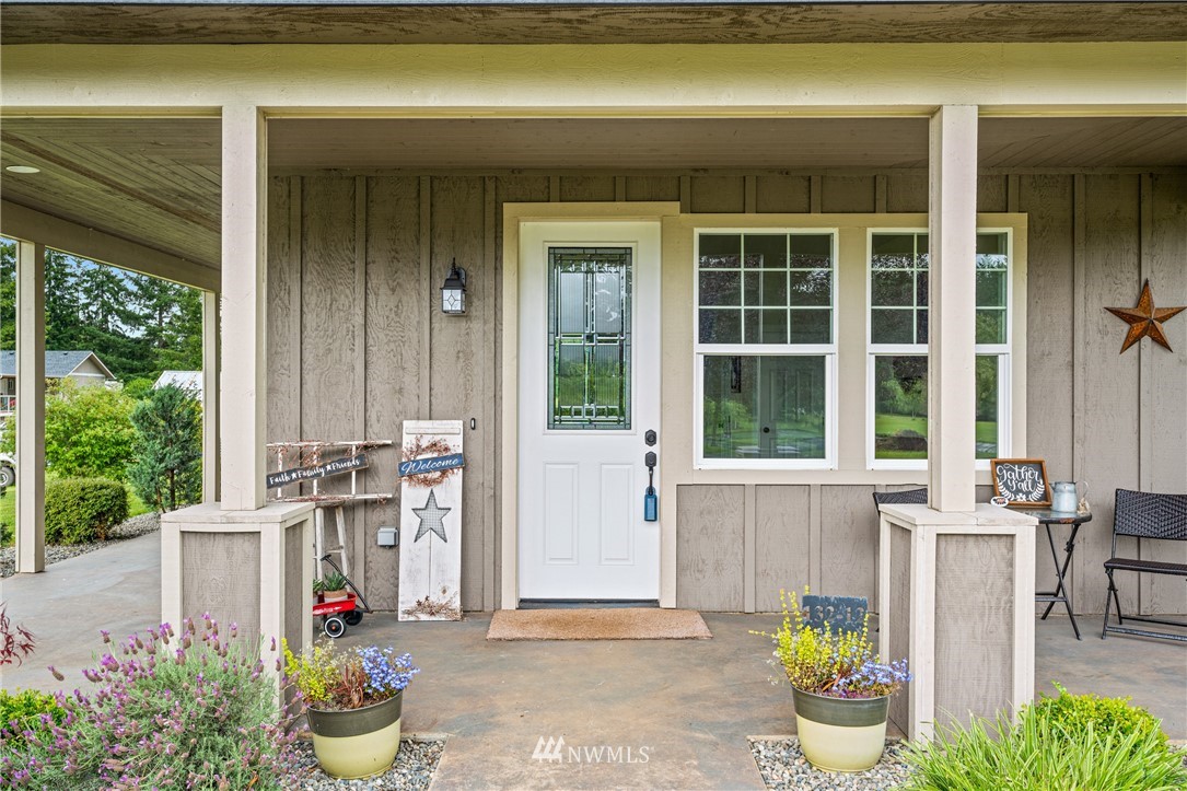 132-12 Pleasant Hill Road Chehalis, WA 98532 - Photo 4 of 25 a front view of a house with outdoor seating