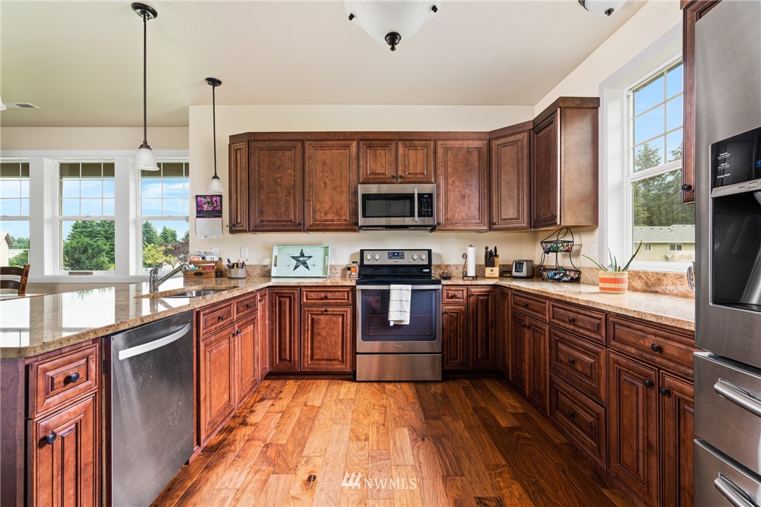 132-12 Pleasant Hill Road Chehalis, WA 98532 - Photo 8 of 25 a kitchen with stainless steel appliances granite countertop a stove sink and cabinets