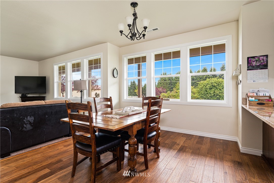 132-12 Pleasant Hill Road Chehalis, WA 98532 - Photo 10 of 25 a view of a dining room with furniture window and wooden floor