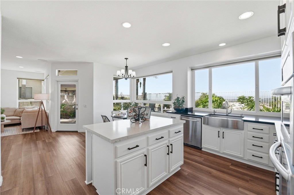 21581 Hummingbird Street Rancho Santa Margarita, CA 92679 - Photo 12 of 56 Freshly Remodeled Kitchen With Center Island and Dining Nook