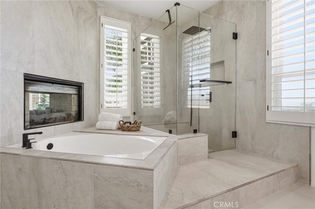 21581 Hummingbird Street Rancho Santa Margarita, CA 92679 - Photo 25 of 56 Tub and Shower with Fireplace