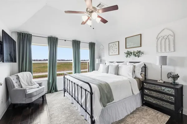 a bedroom with a bed and a couch