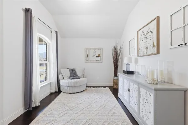 a spacious bedroom with a bed and a couch
