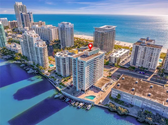 a view of city and patio with swimming pool
