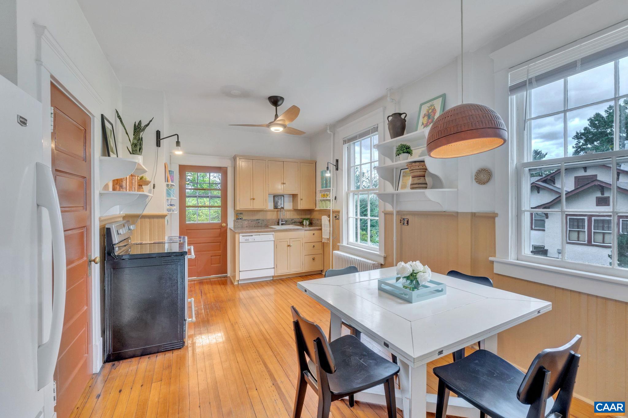 945 Locust Avenue Charlottesville, VA 22901 - Photo 12 of 52 a living room with furniture a dining table and kitchen view