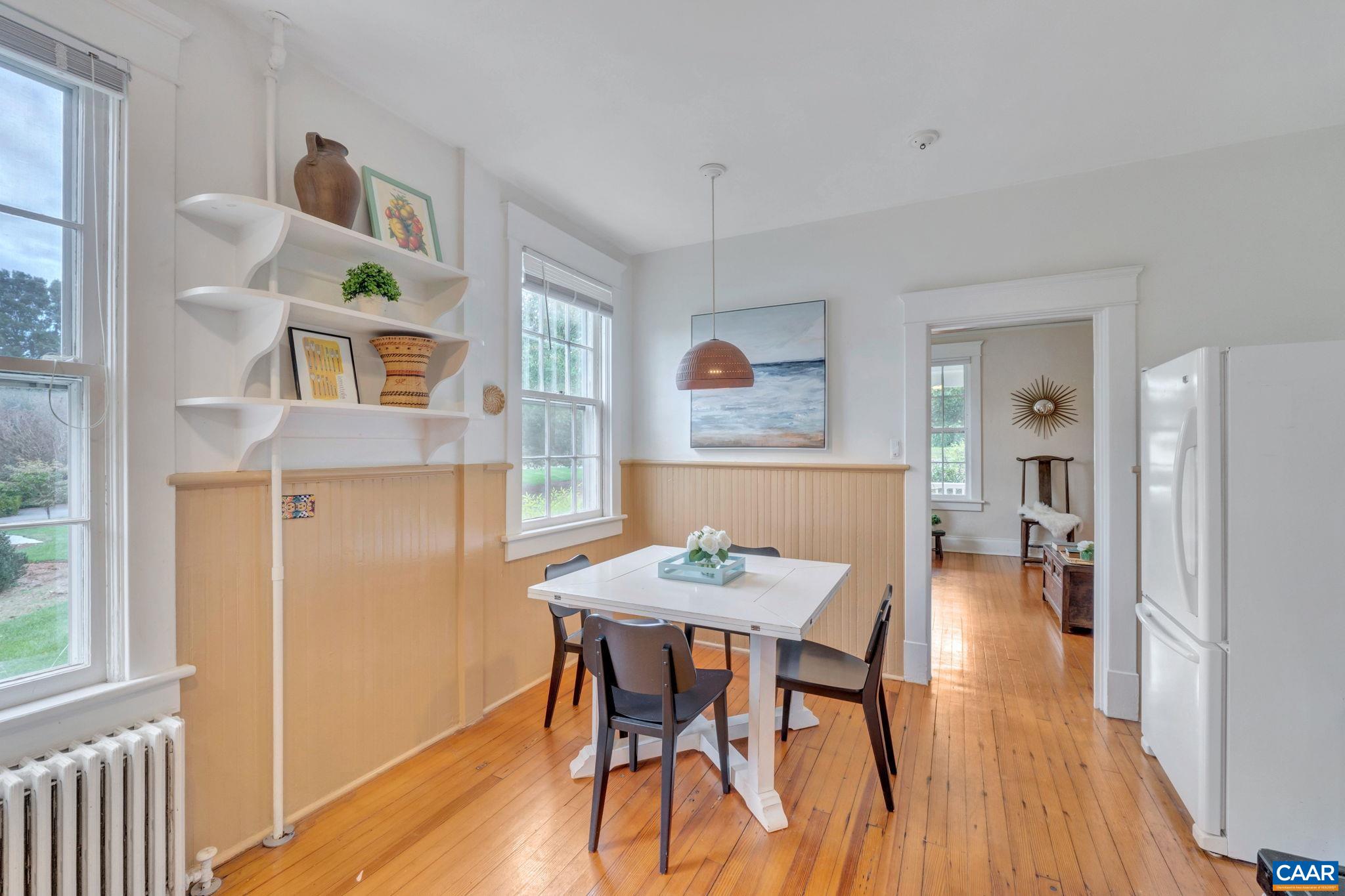 945 Locust Avenue Charlottesville, VA 22901 - Photo 14 of 52 a view of a dining room with furniture and wooden floor