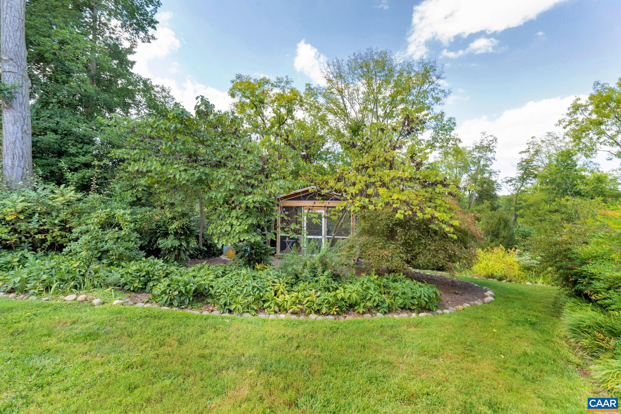 945 Locust Avenue Charlottesville, VA 22901 - Photo 39 of 52 a view of a garden with a house