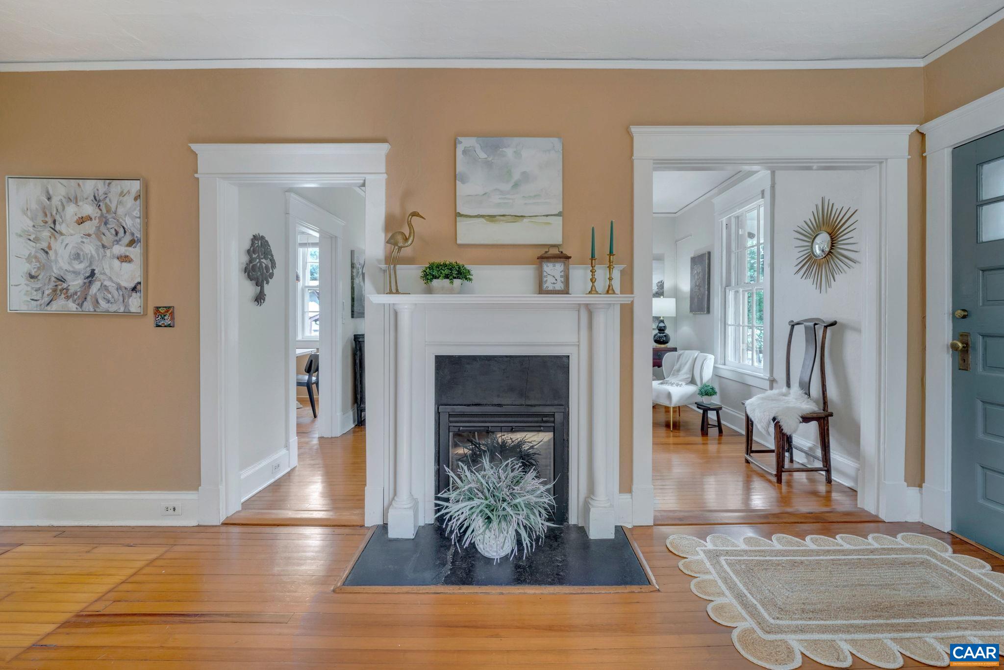 945 Locust Avenue Charlottesville, VA 22901 - Photo 8 of 52 a living room with furniture and a fireplace