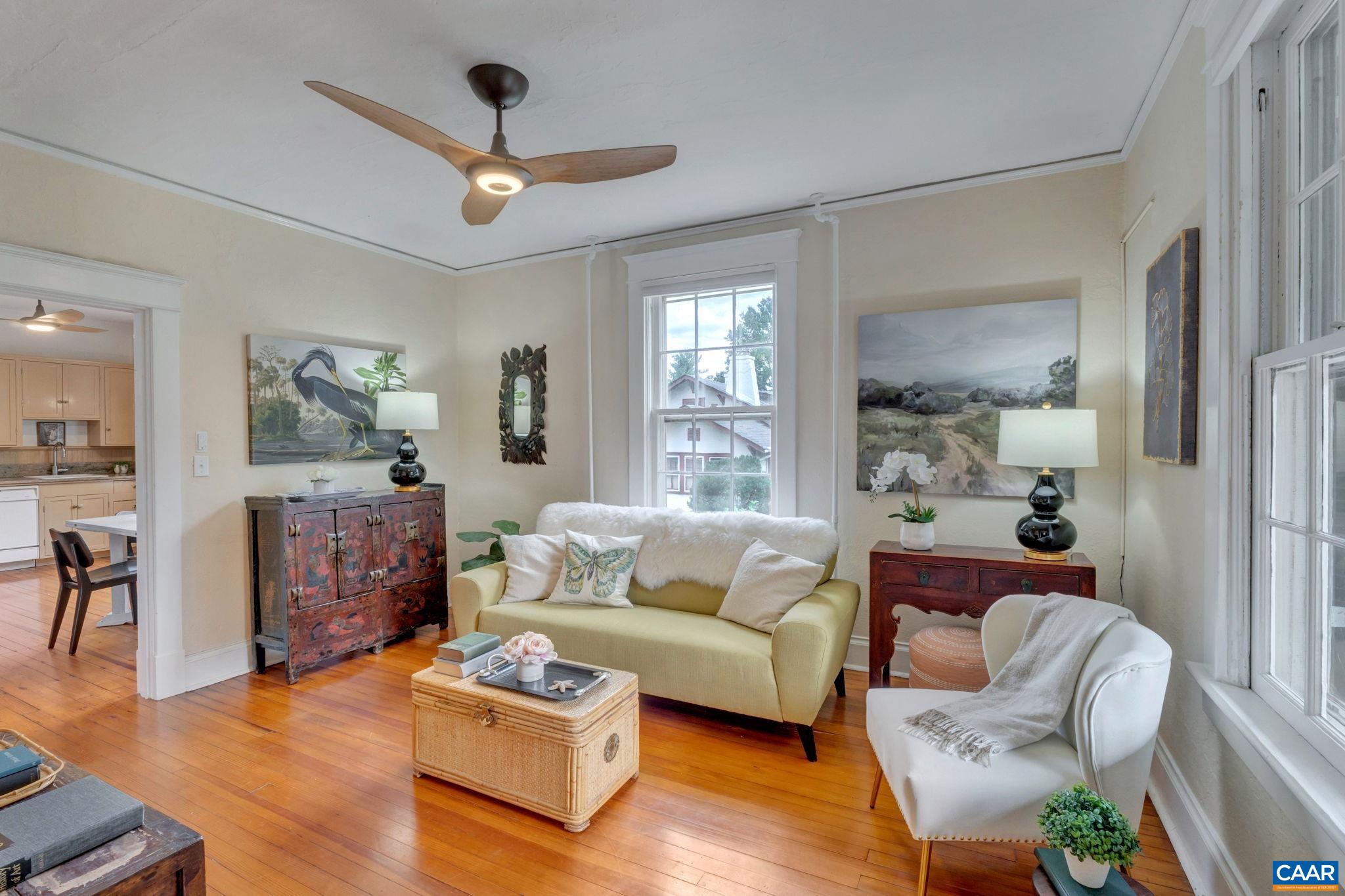 945 Locust Avenue Charlottesville, VA 22901 - Photo 9 of 52 a living room with furniture and a chandelier