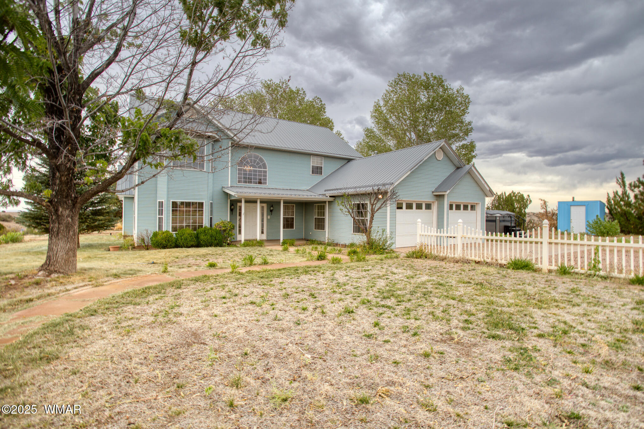 9410 Butler Trail Snowflake, AZ 85937 - Photo 2 of 62 a front view of a house with a yard