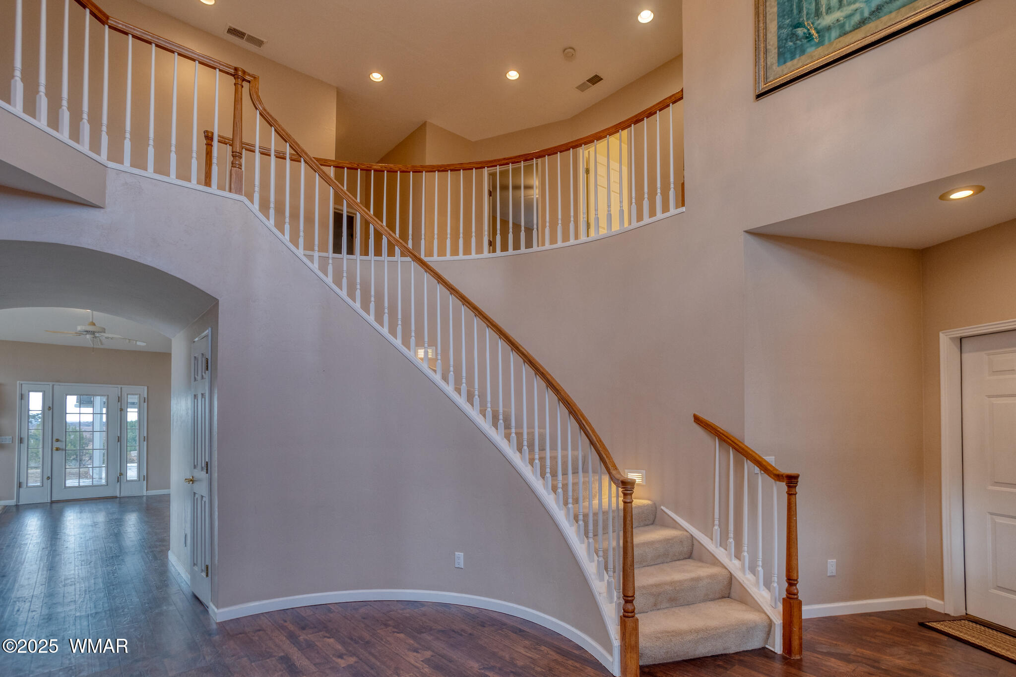 9410 Butler Trail Snowflake, AZ 85937 - Photo 22 of 62 a view of staircase with lots of frames and stairs