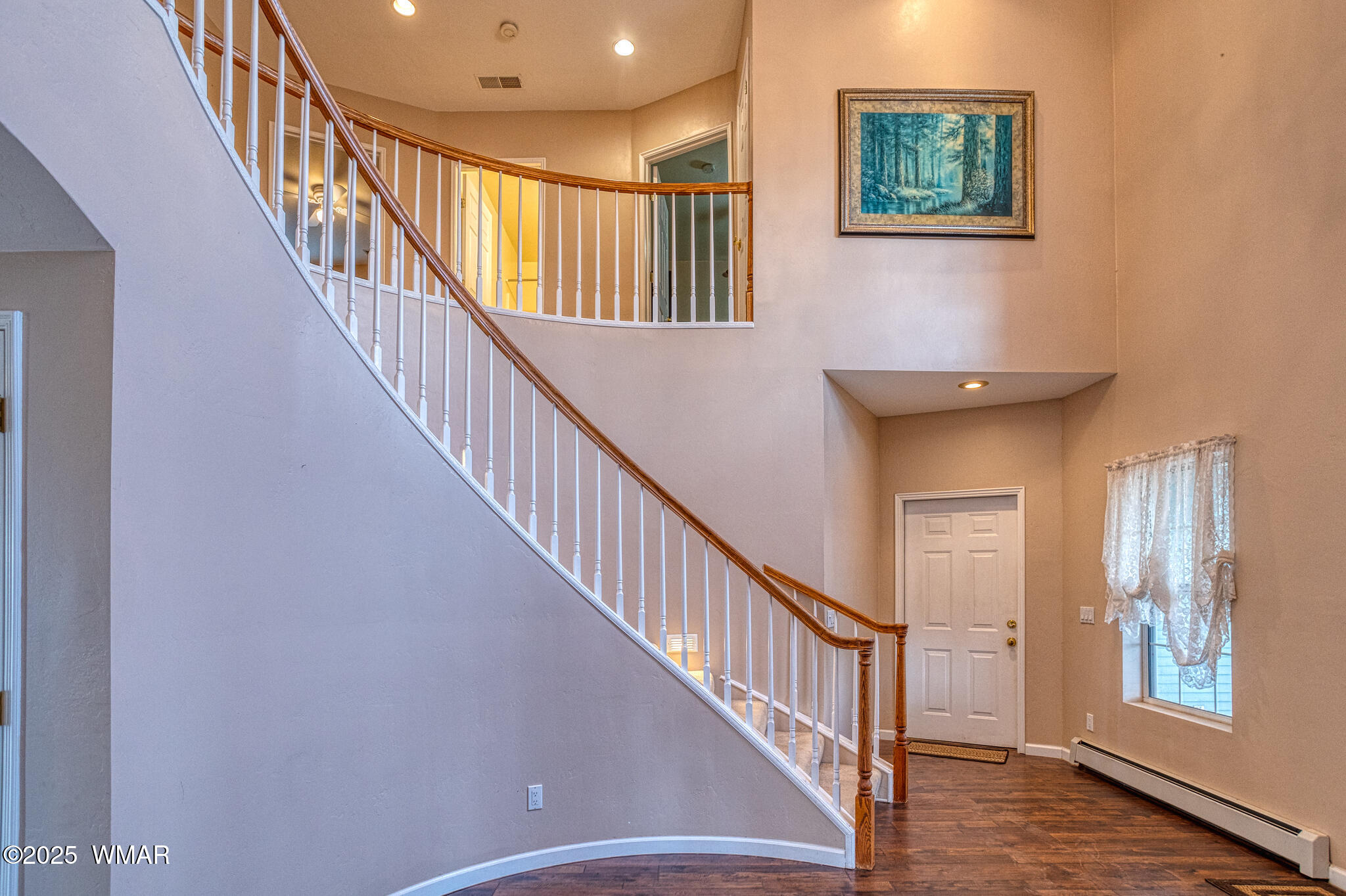9410 Butler Trail Snowflake, AZ 85937 - Photo 23 of 62 a view of staircase with lots of frames and windows