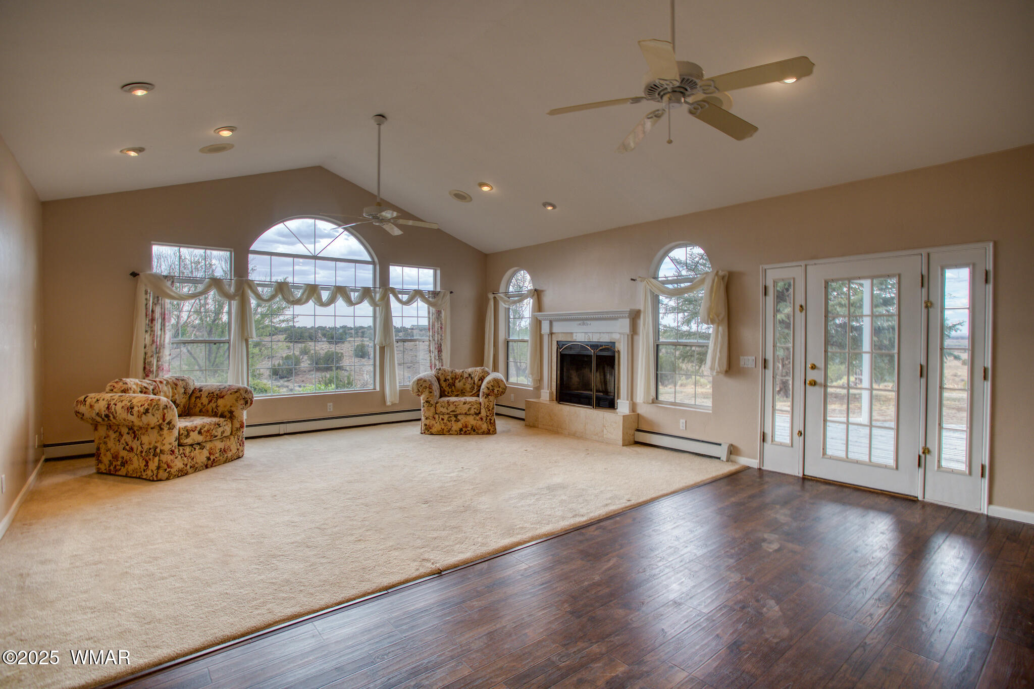 9410 Butler Trail Snowflake, AZ 85937 - Photo 28 of 62 a view of a livingroom with furniture fire place and chandelier