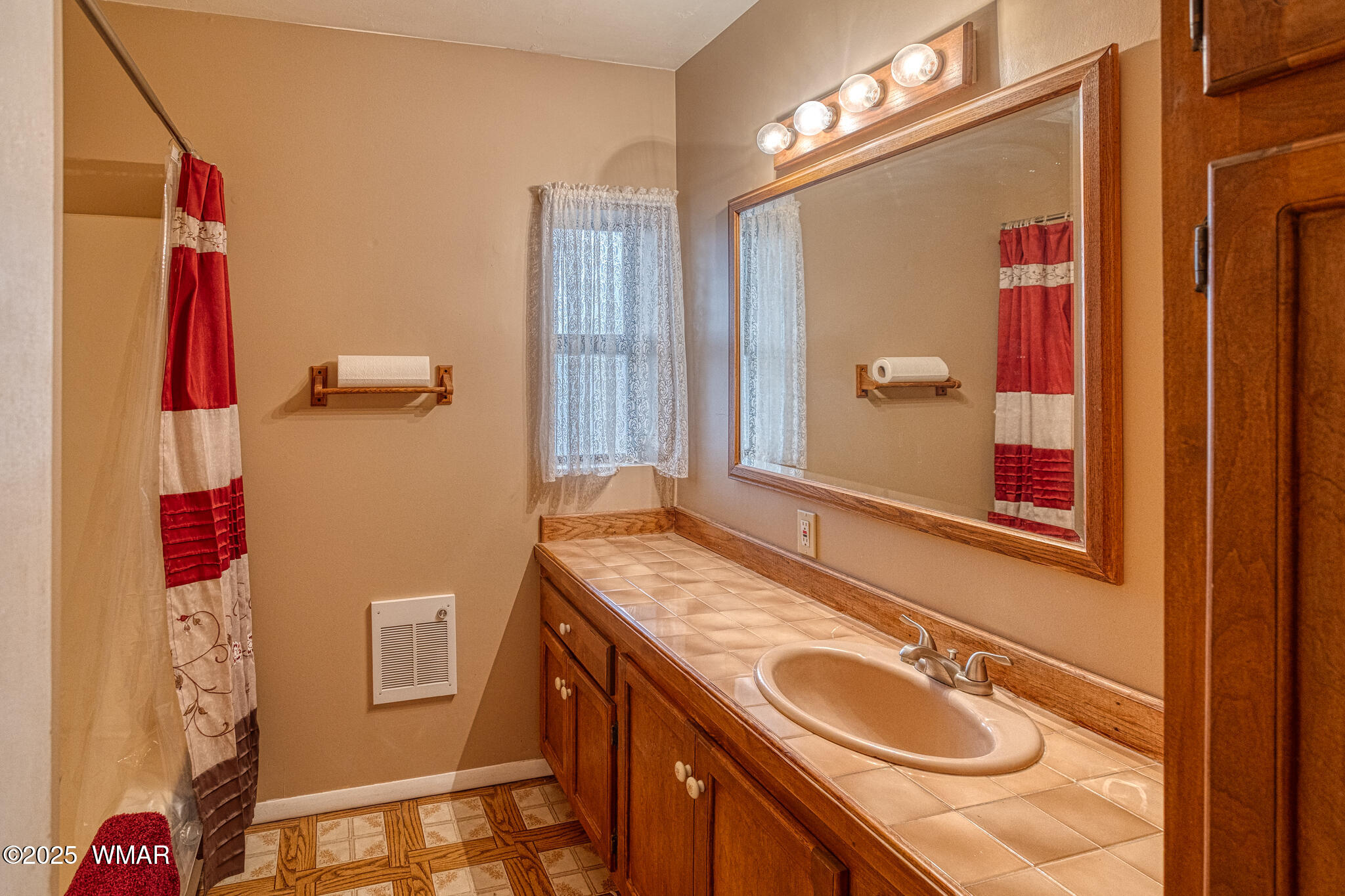 9410 Butler Trail Snowflake, AZ 85937 - Photo 43 of 62 a bathroom with a granite countertop double vanity sink a mirror and a shower