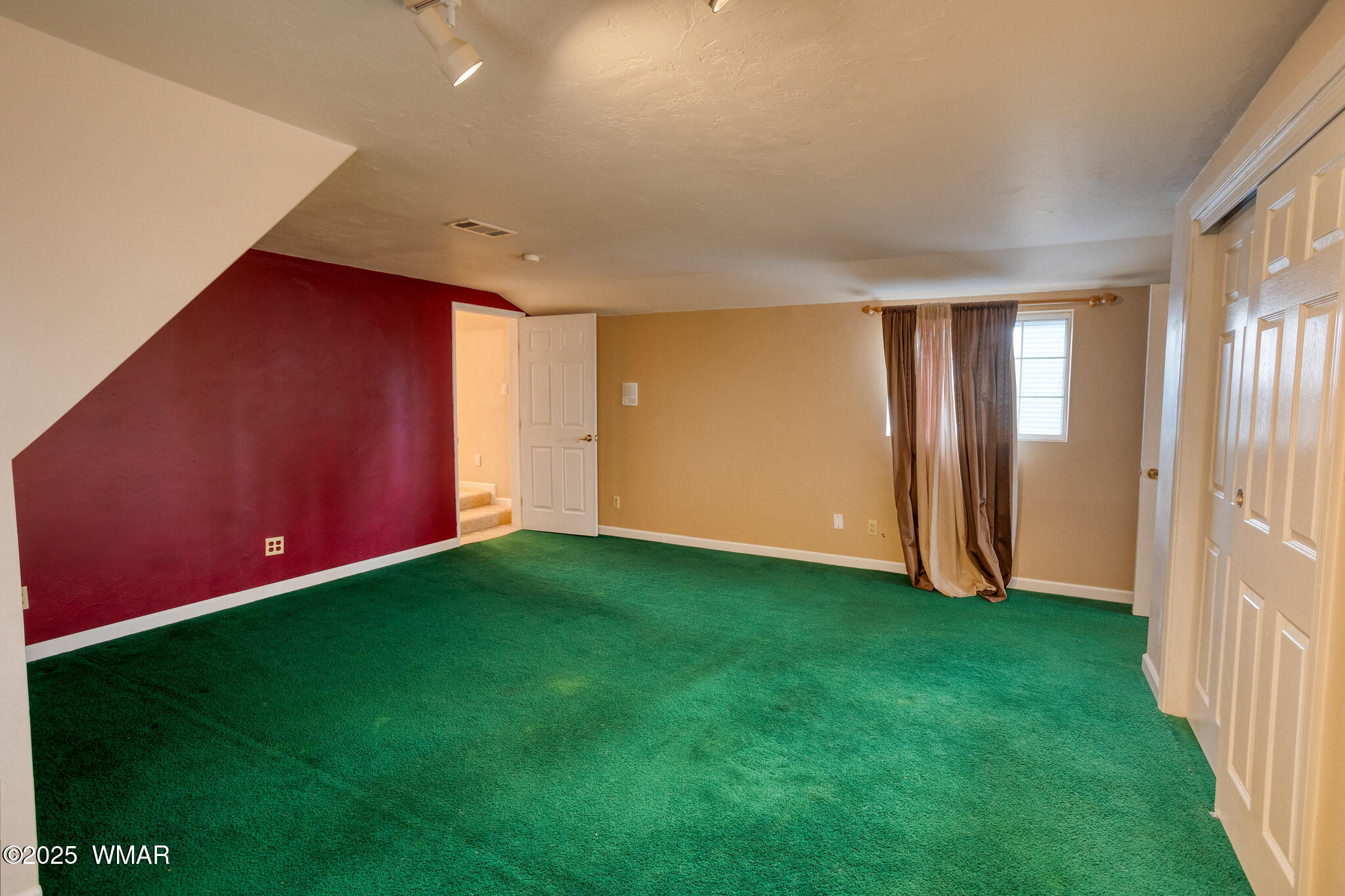 9410 Butler Trail Snowflake, AZ 85937 - Photo 52 of 62 a view of an empty room with window and stairs
