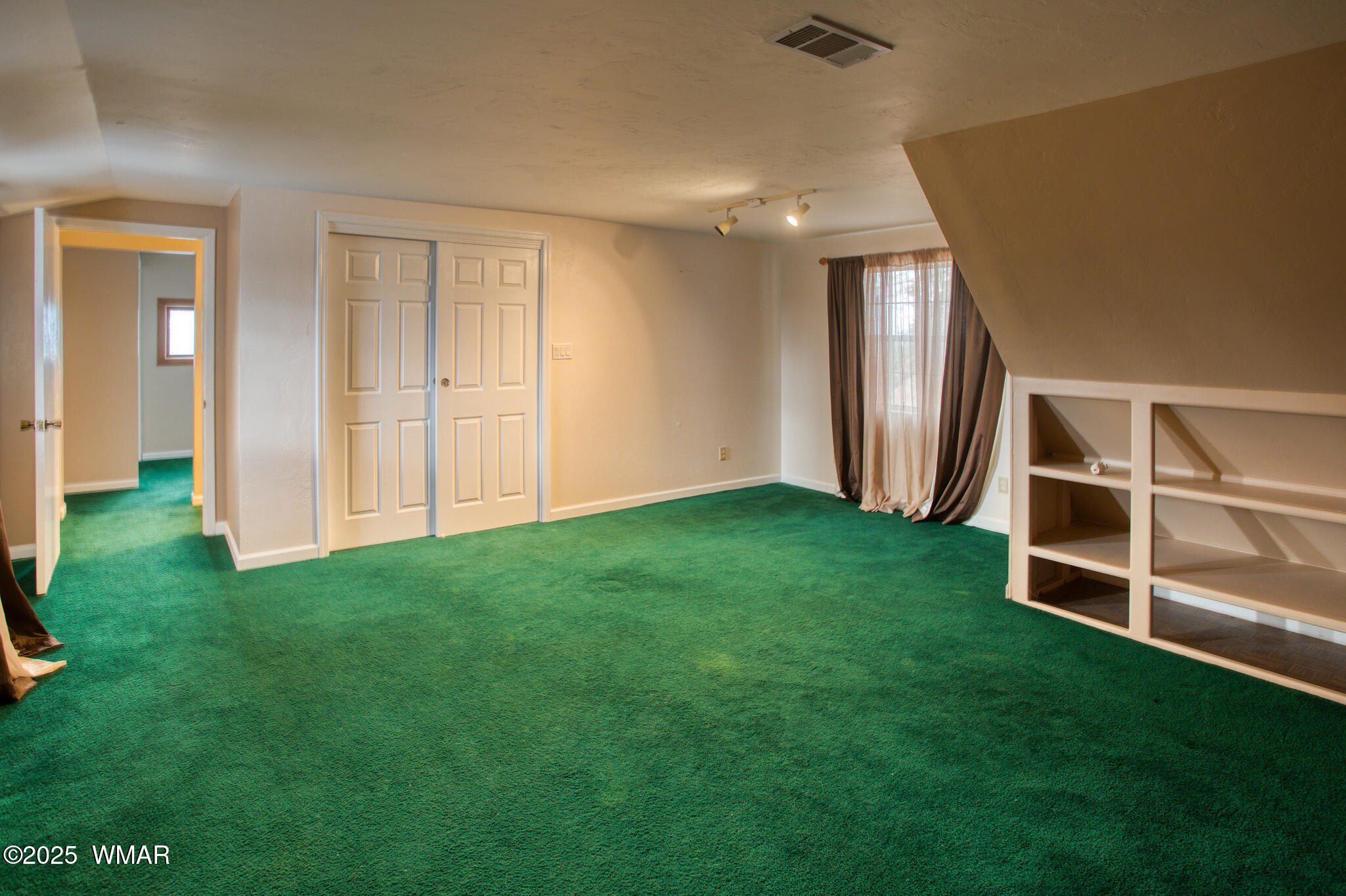 9410 Butler Trail Snowflake, AZ 85937 - Photo 58 of 62 a view of an empty room with wooden floor and a window